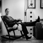 man sitting in a rocking chair